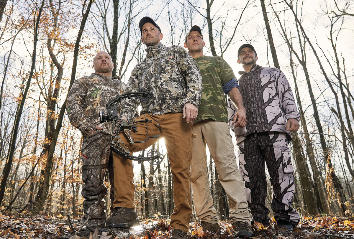 DRESSED TO KILL
Melillo (holding bow) with Wayne Davis (second from right), who helped track the bear, and hunting buddies Marc Yodice and Jason Famularo.
